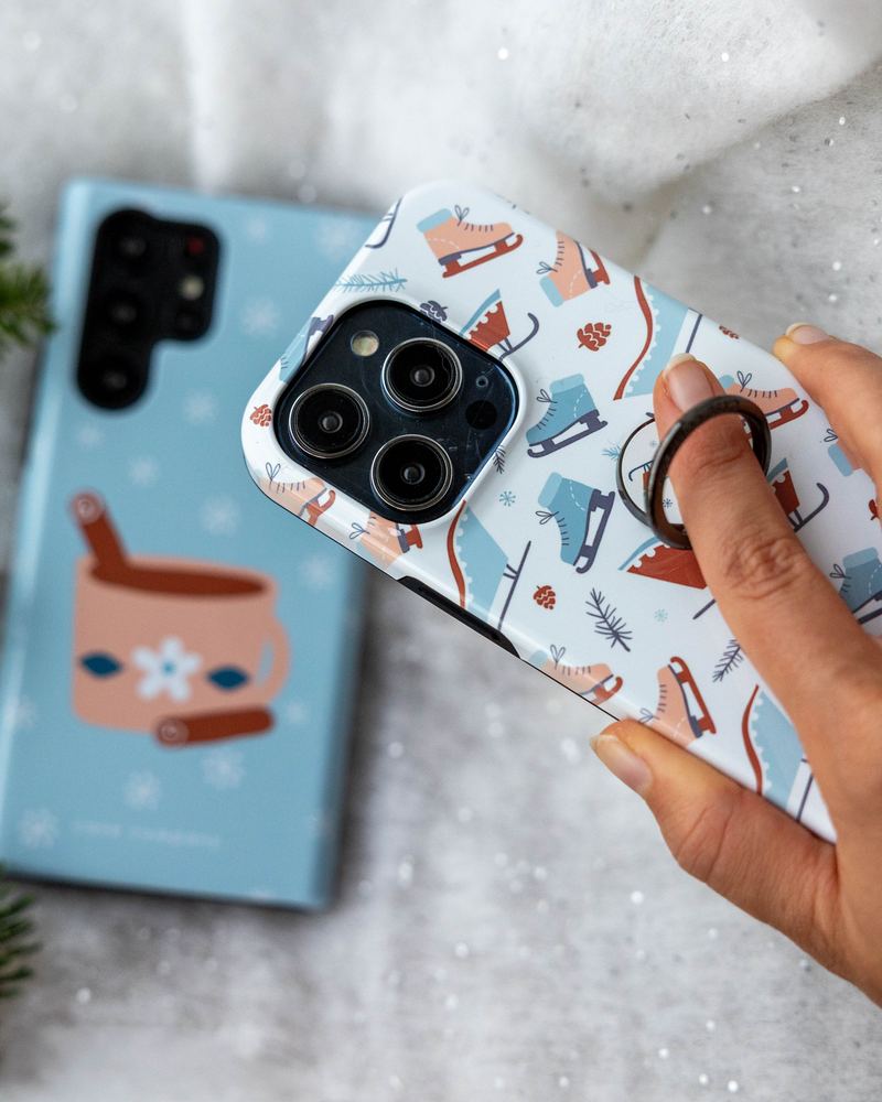 Black ring holder on a case with a winter print