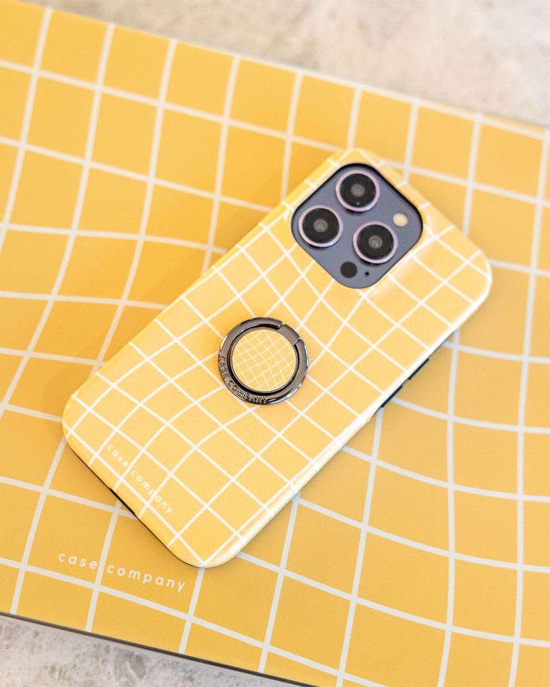 Black ring holder on a yellow checked case
